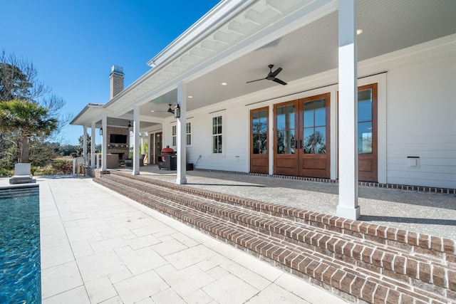 view of patio featuring ceiling fan