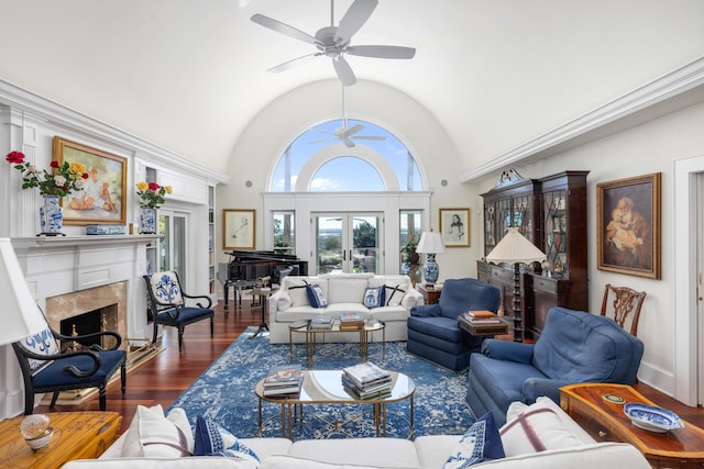 living room featuring ceiling fan, dark wood-type flooring, and high vaulted ceiling