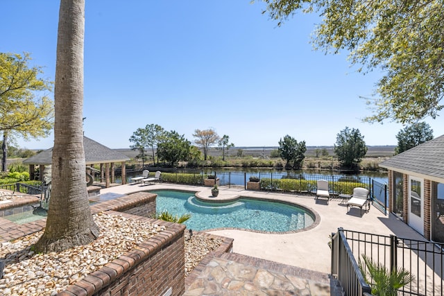 view of swimming pool with a patio and a hot tub