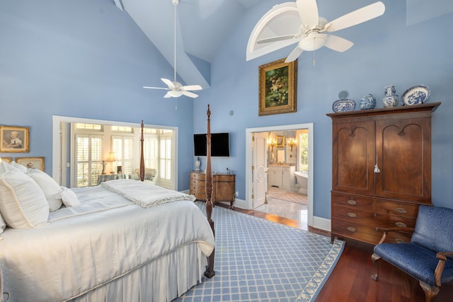 bedroom featuring multiple windows, ceiling fan, high vaulted ceiling, and dark tile flooring