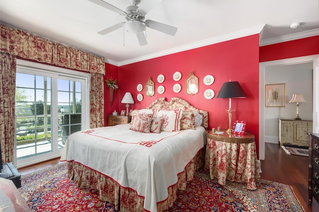 bedroom featuring dark hardwood / wood-style flooring, multiple windows, access to exterior, and ceiling fan