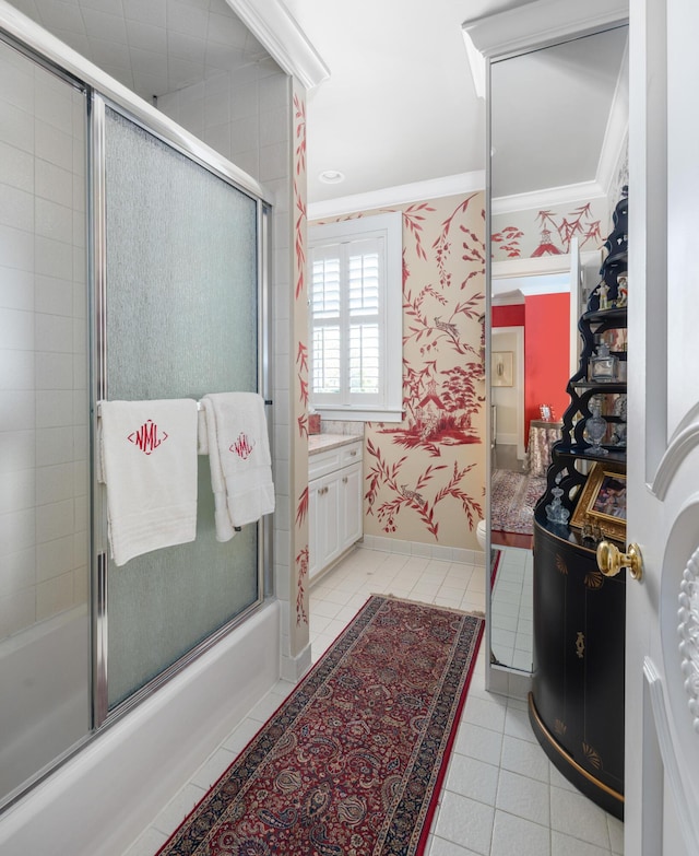 bathroom with crown molding, tile flooring, bath / shower combo with glass door, and vanity