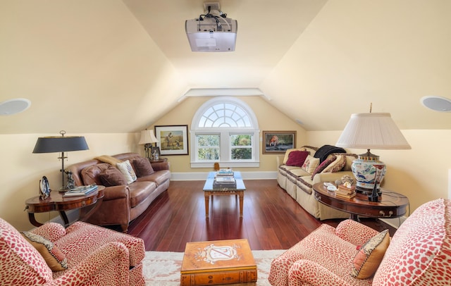 living room featuring dark hardwood / wood-style flooring and vaulted ceiling