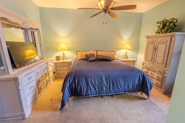 bedroom with light carpet and ceiling fan