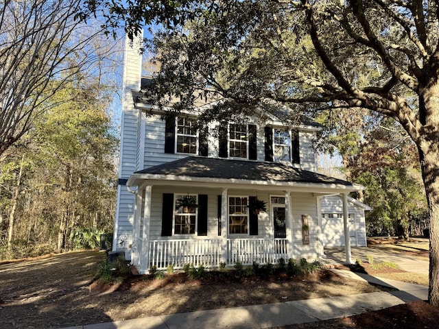 view of front facade featuring a garage and covered porch