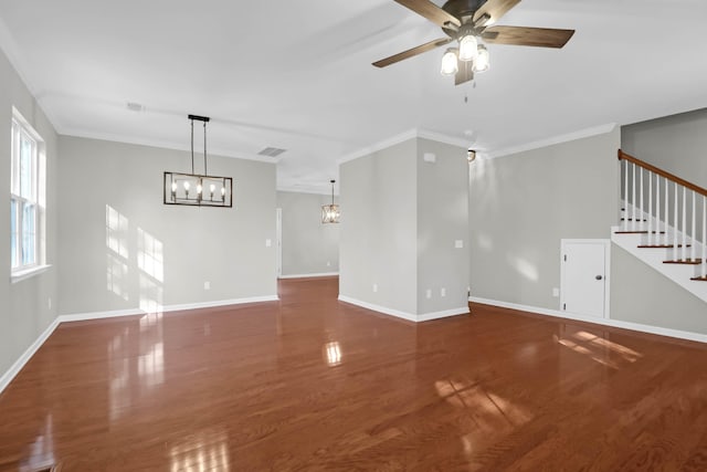 unfurnished living room with crown molding, ceiling fan with notable chandelier, and dark hardwood / wood-style floors