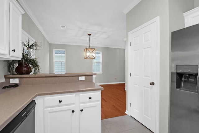 kitchen featuring white cabinetry, hanging light fixtures, light tile patterned floors, ornamental molding, and stainless steel appliances