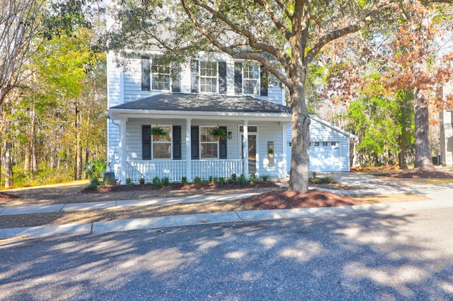 view of front of property with a garage and covered porch