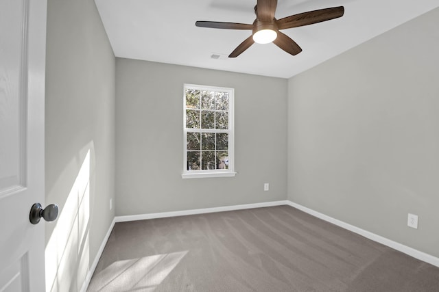 carpeted empty room featuring ceiling fan