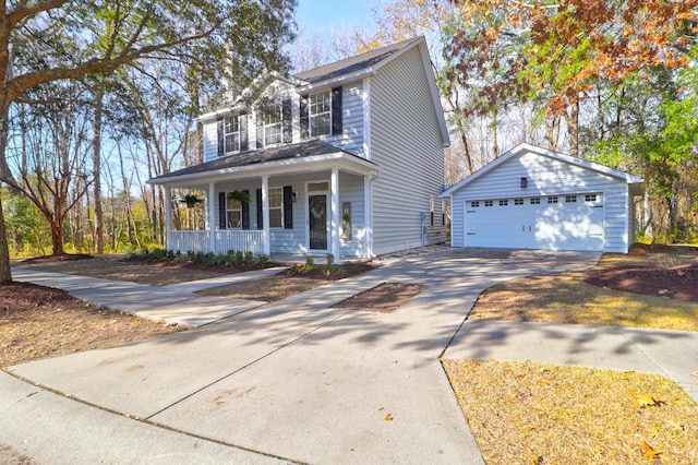 view of front facade featuring a garage, an outdoor structure, and covered porch