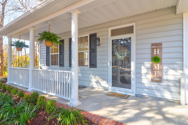 entrance to property featuring covered porch