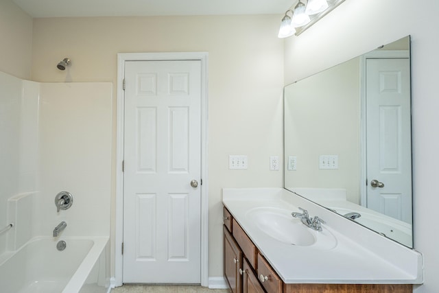 bathroom featuring vanity and washtub / shower combination