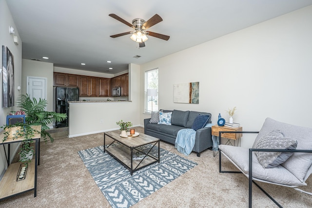 living area with recessed lighting, visible vents, light carpet, ceiling fan, and baseboards