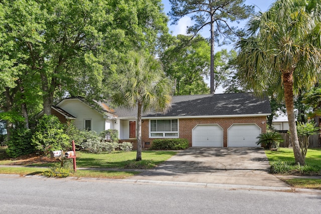 view of front of home with a garage and a front yard