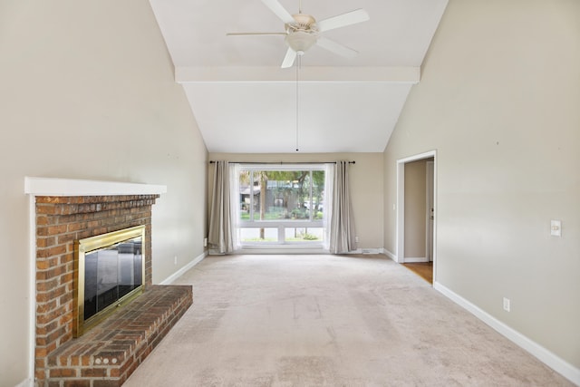 unfurnished living room featuring a fireplace, light colored carpet, high vaulted ceiling, and ceiling fan