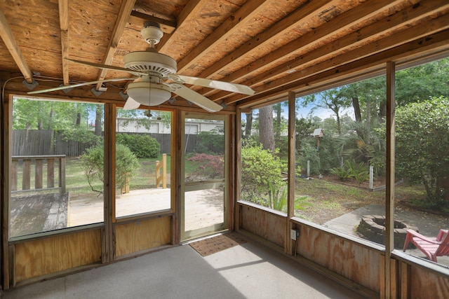 unfurnished sunroom featuring ceiling fan