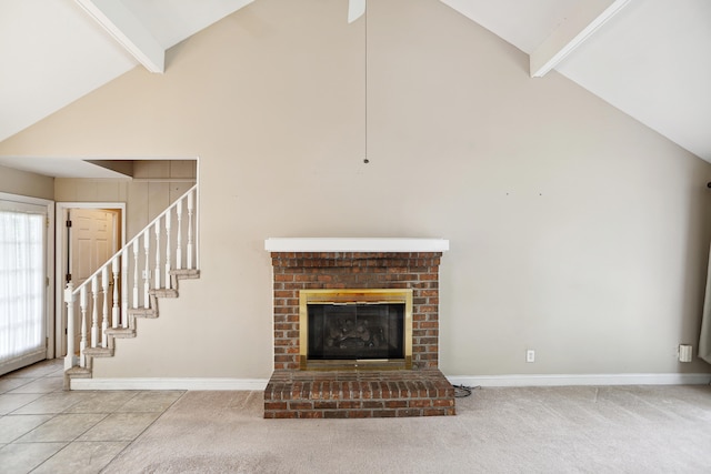 unfurnished living room with beamed ceiling, carpet, and high vaulted ceiling