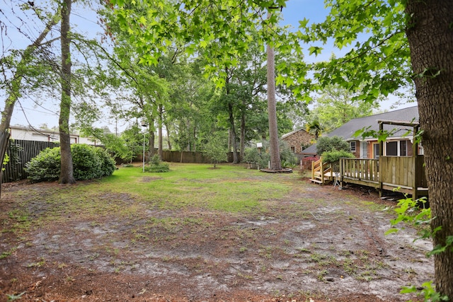 view of yard featuring a wooden deck