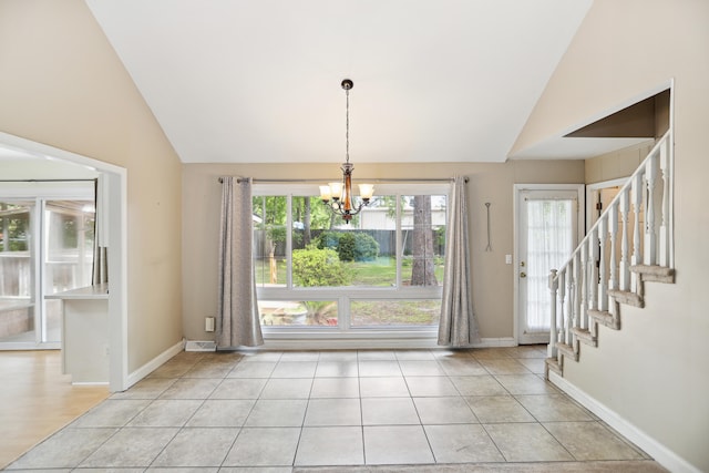 interior space featuring a notable chandelier, light tile patterned flooring, and a wealth of natural light