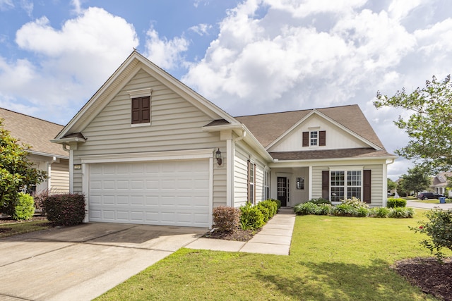 view of front of house featuring a garage and a front lawn