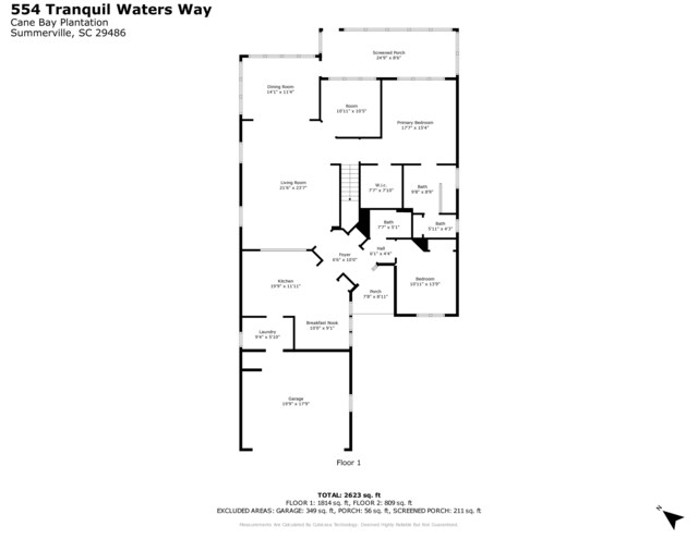 view of yard featuring a garage and a sunroom