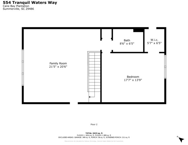 view of yard featuring a sunroom and a garage