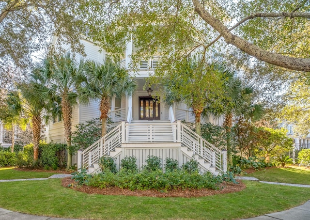 view of front of home featuring a porch and a front lawn