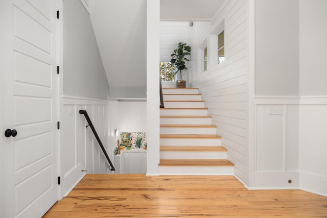 stairs with wood-type flooring