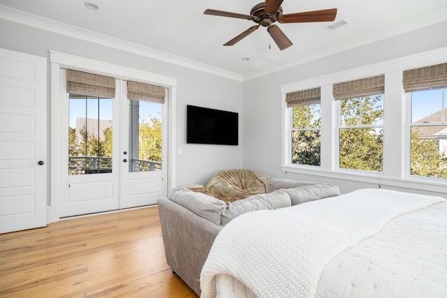 bedroom with access to exterior, light hardwood / wood-style floors, ceiling fan, and crown molding