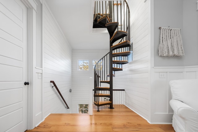 stairway with hardwood / wood-style flooring