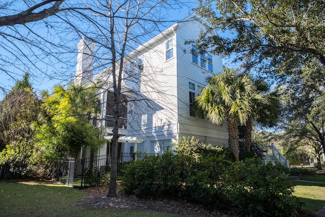 view of property exterior featuring a lawn