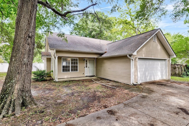 2919 Fernwood Dr, North Charleston, SC 29406 - ranch-style home with a garage, a shingled roof, fence, and concrete driveway