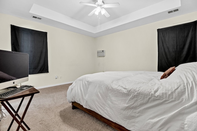 2919 Fernwood Dr, North Charleston, SC 29406 - bedroom featuring visible vents, baseboards, carpet floors, and a tray ceiling