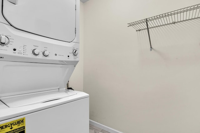 2919 Fernwood Dr, North Charleston, SC 29406 - laundry area featuring stacked washing maching and dryer, baseboards, and laundry area