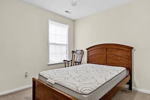2919 Fernwood Dr, North Charleston, SC 29406 - bedroom featuring baseboards, visible vents, light carpet, and ceiling fan