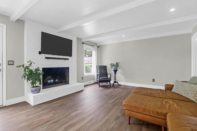 1468 N Relyea Ave, Charleston, SC 29412 - living area with beam ceiling, wood finished floors, a brick fireplace, and recessed lighting