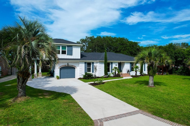 1468 N Relyea Ave, Charleston, SC 29412 - view of front of property featuring driveway, a front lawn, and a garage