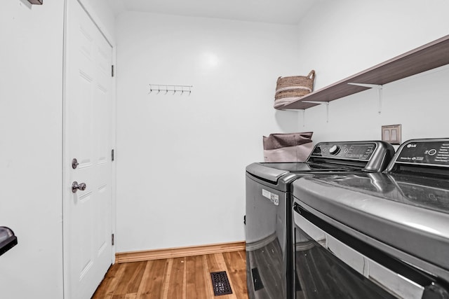 1468 N Relyea Ave, Charleston, SC 29412 - laundry room featuring washer and clothes dryer and light wood finished floors