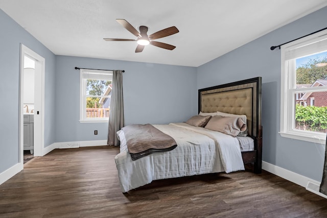 1468 N Relyea Ave, Charleston, SC 29412 - bedroom featuring dark wood finished floors, ensuite bathroom, and a ceiling fan