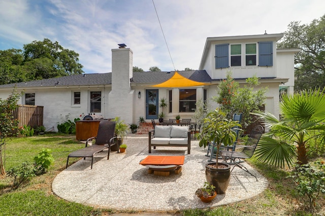1468 N Relyea Ave, Charleston, SC 29412 - back of house with a patio area, a chimney, an outdoor living space, and a yard