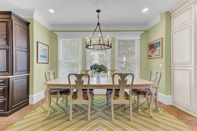 tiled dining area with a chandelier and ornamental molding