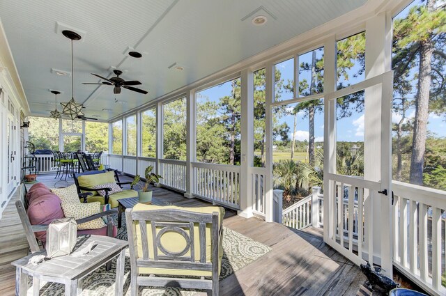 sunroom / solarium with ceiling fan