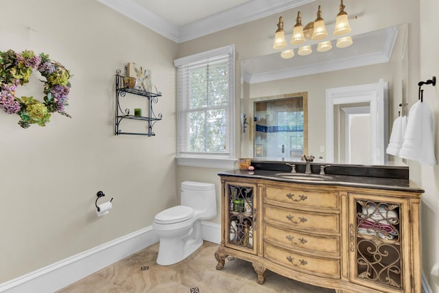 bathroom featuring vanity, toilet, and ornamental molding