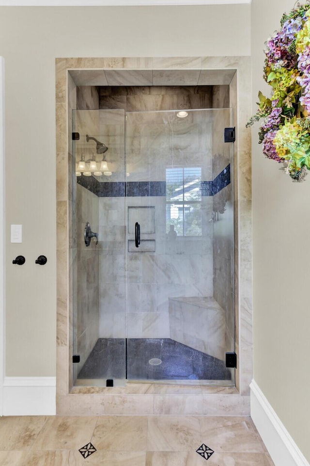 bathroom featuring an enclosed shower