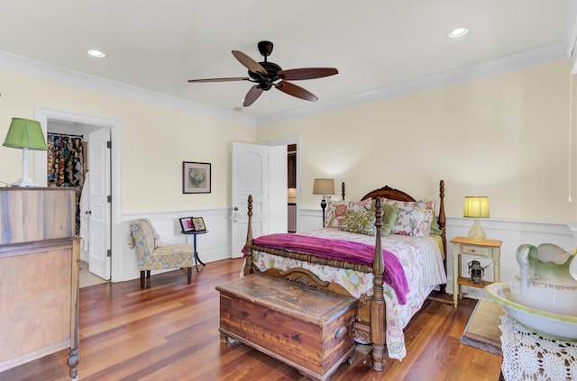 bedroom featuring wood-type flooring, ceiling fan, and ornamental molding