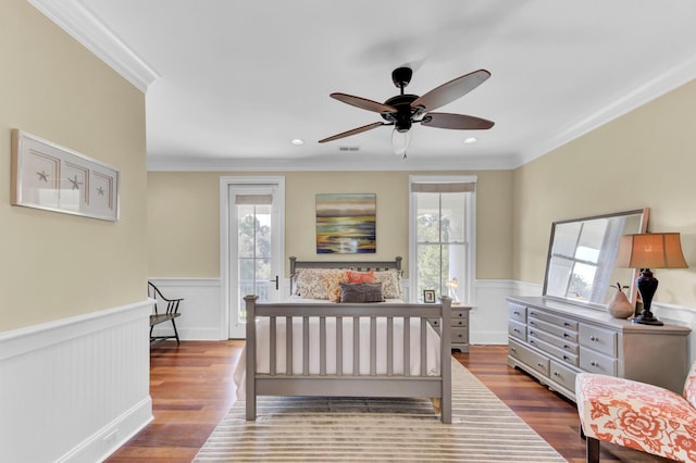 bedroom with ceiling fan, light hardwood / wood-style floors, and ornamental molding