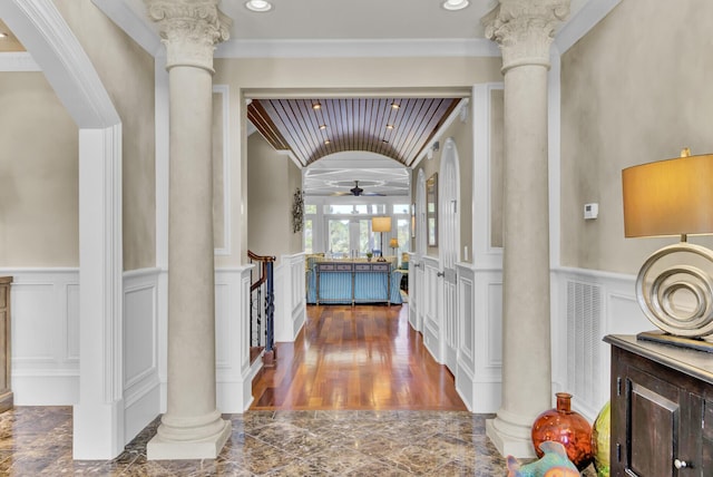 hallway featuring decorative columns and ornamental molding