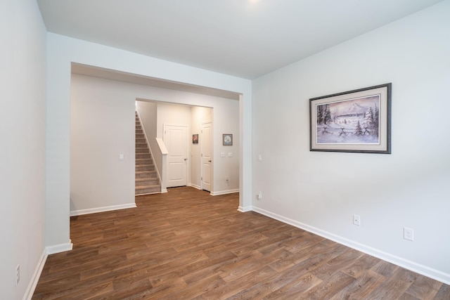 empty room with dark hardwood / wood-style floors