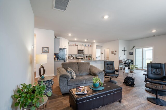 living room with hardwood / wood-style flooring