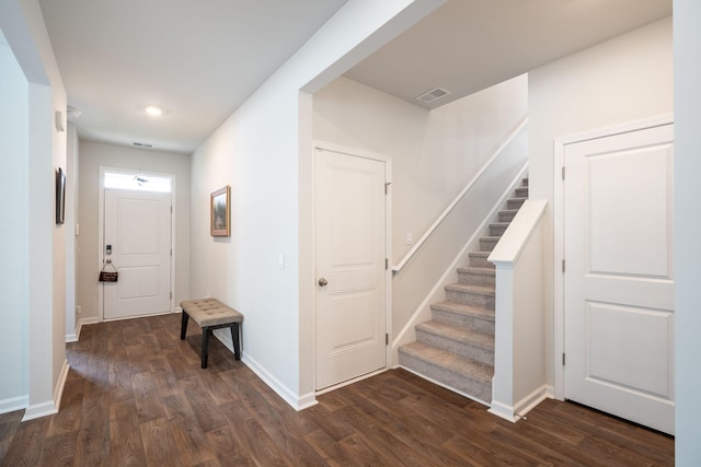 foyer entrance with dark hardwood / wood-style flooring